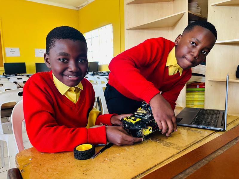 Two pupils at a laptop in the computer lab